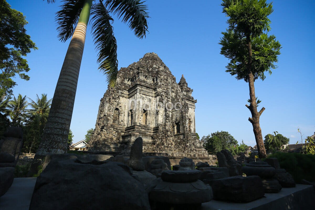 Kalasan Temple viewed through surrounding trees in Sleman, Yogyakarta.