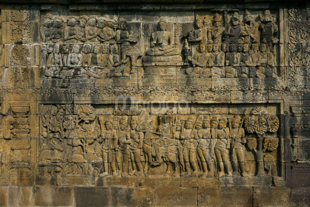 A detailed relief panel at Borobudur Temple.