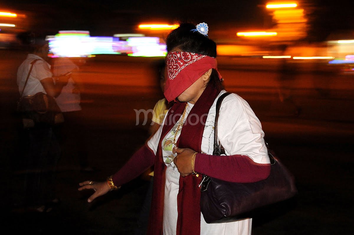 A visitor plays the masangin game, blindfolded, at Alun-Alun Kidul in Yogyakarta.