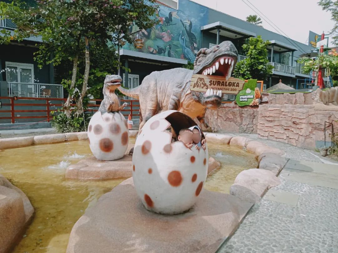 Dinosaur statues and eggs at Suraloka Interactive Zoo.