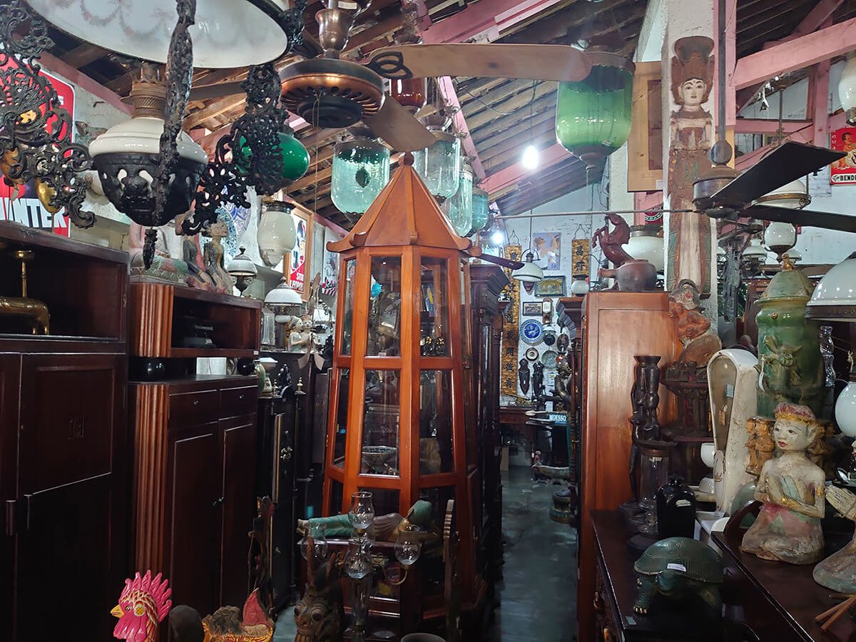 Interior of an art shop in Prawirotaman filled with antique items and collectibles.