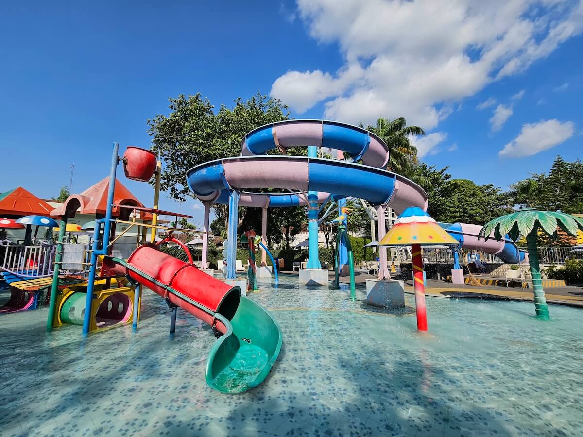 Colorful water slides and play structures at Aqua Splash in Kids Fun Park.