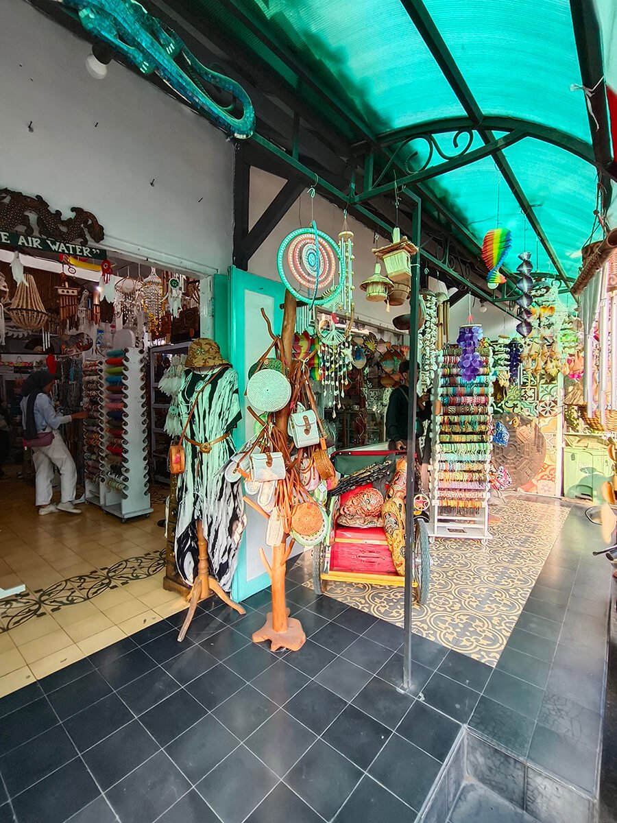 A vibrant art shop in Prawirotaman displaying various colorful crafts and accessories.