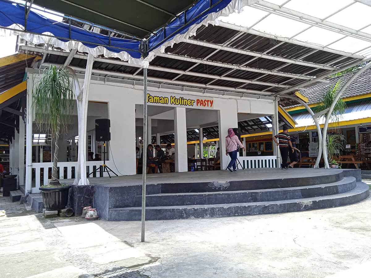 Empty performance stage in front of Taman Kuliner PASTY in Yogyakarta.