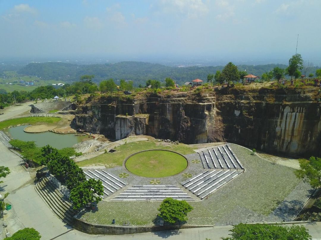 Tlatar Seneng open-air stage at Breksi Cliff with ample seating and natural surroundings.