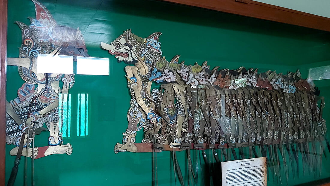 Close-up of a wayang kulit display case at Museum Wayang Kekayon.