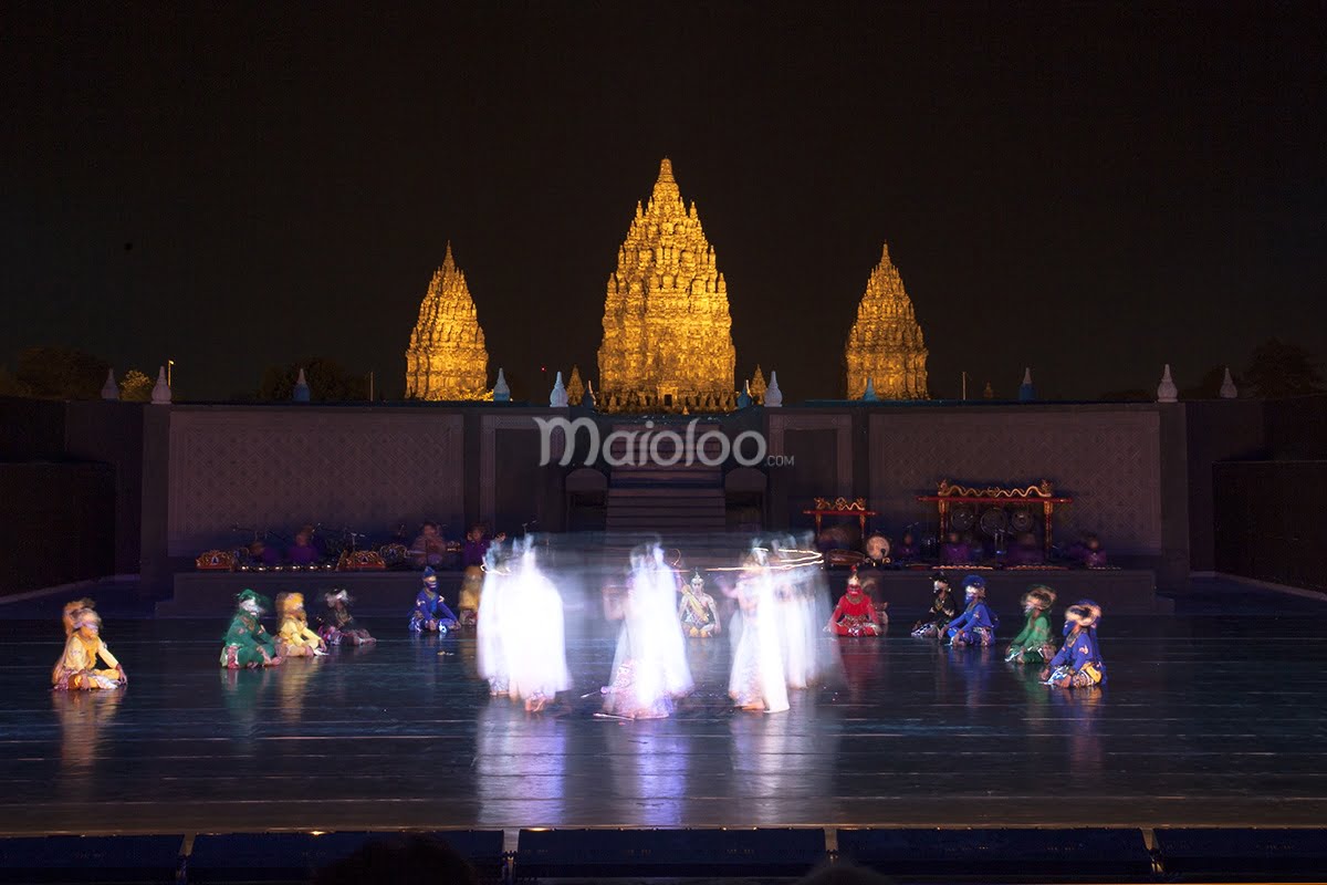 Dancers performing at the Ramayana Ballet in front of Prambanan Temple at night.