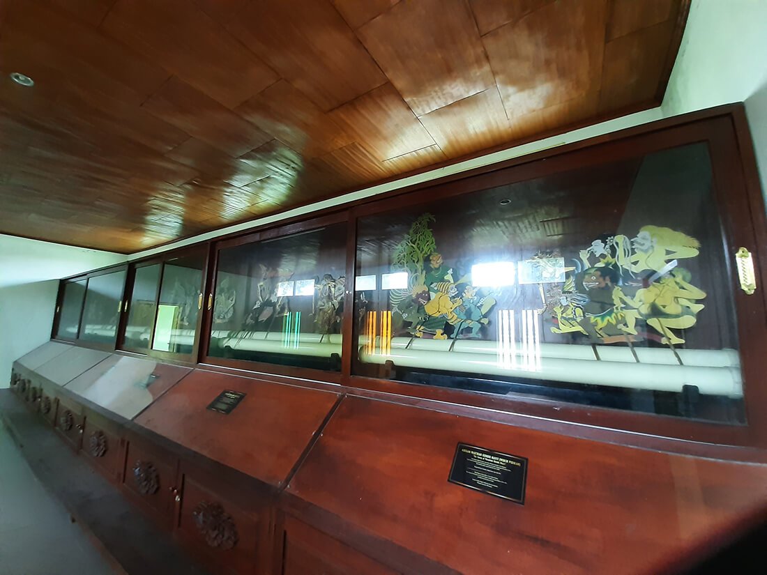 Display case with wayang kulit puppets inside Museum Wayang Kekayon.