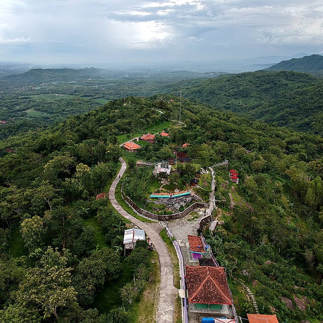 Aerial view of winding paths and lush green hills at Green Village Gedangsari in Gunungkidul, Yogyakarta.